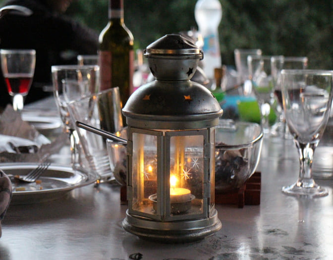 Restaurant table decorated with vintage lanterns