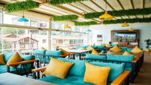 A restaurant dining are with fabric chairs