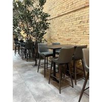 Amata Barstools shown with tables in restaurant
