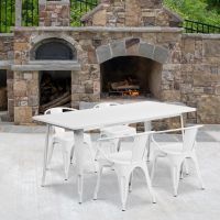 White 31.5" x 63" rectangular metal table with 4 arm chairs