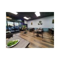 T52 Graphite Color Laminate Table Tops with Chairs in a Restaurant