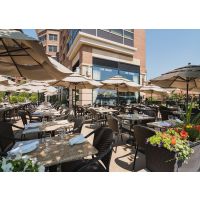 Square Granite Table Tops placed at outdoor restaurant in Kashmir White color 