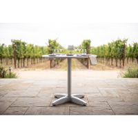 Spun metal table tops at vineyard