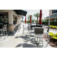 Spun metal table tops outside restaurant